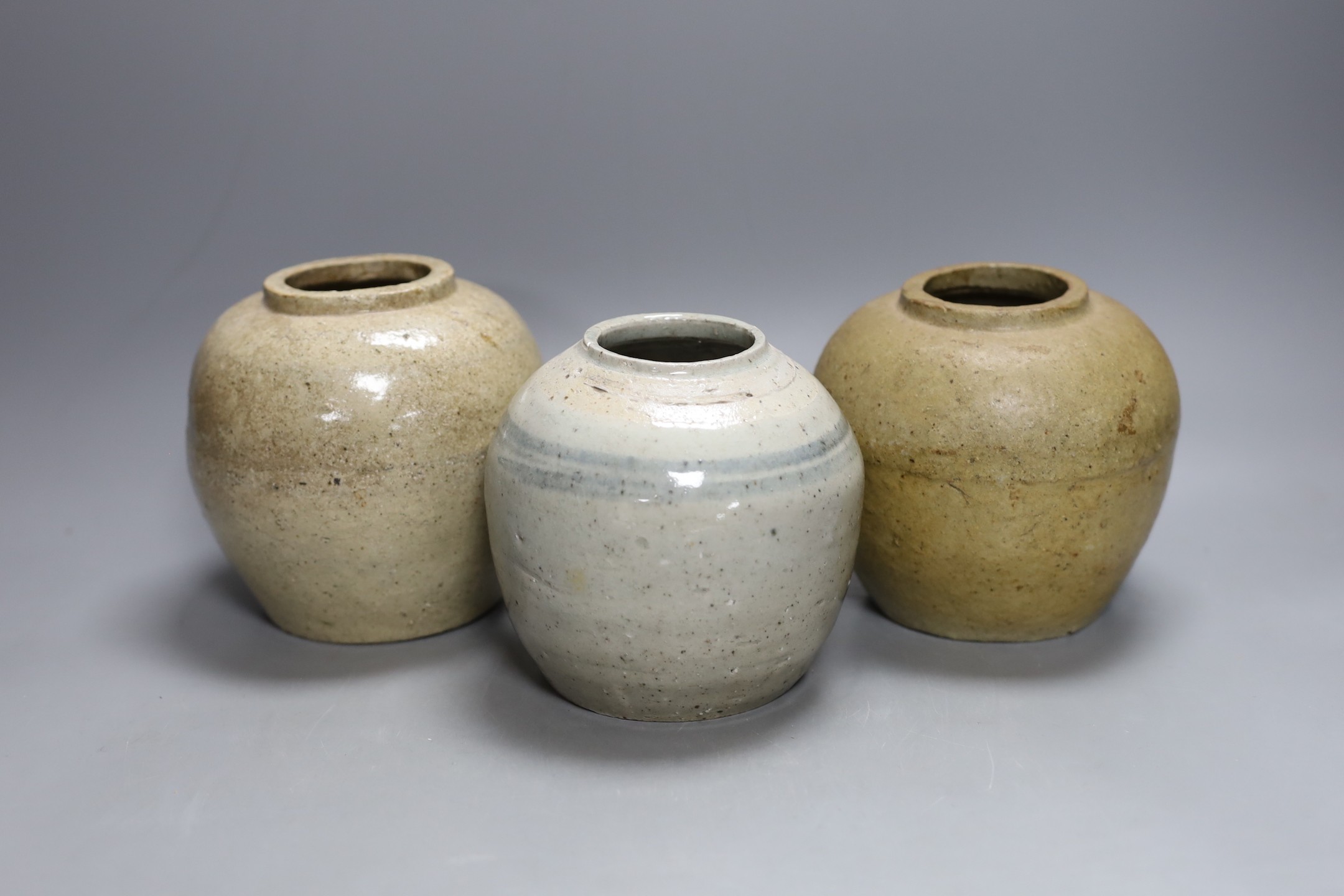 Three Chinese provincial pottery storage jars, Qing dynasty - 13cm tall